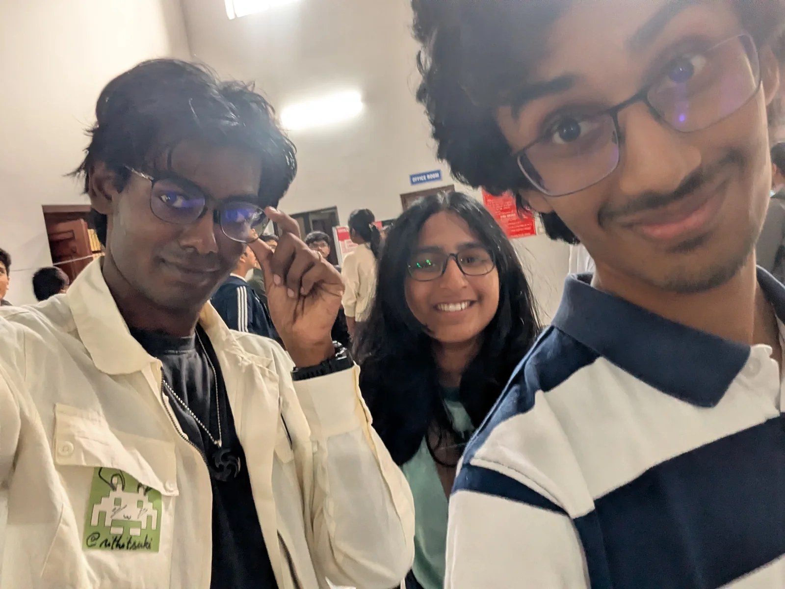 A selfie of me with Nikhil and Amara in the hall.